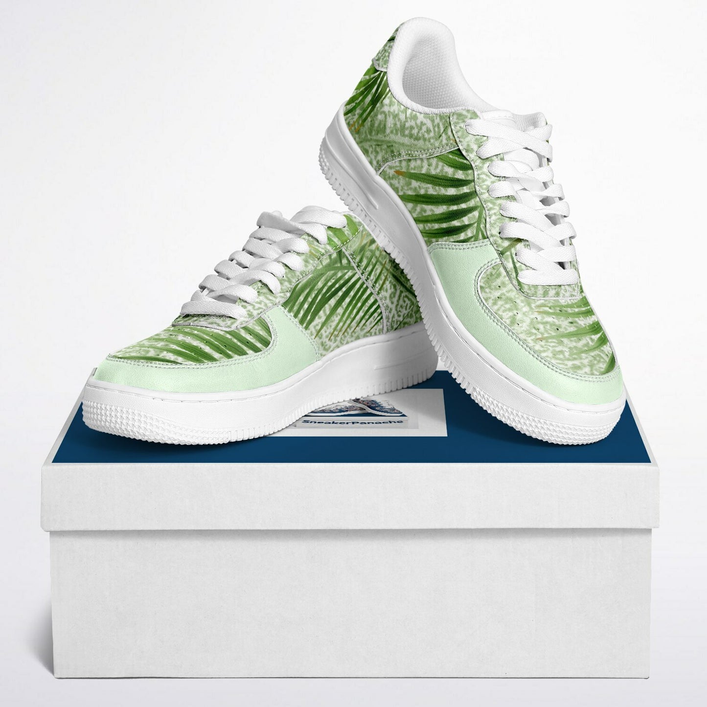 Sneakers in mint green with green jungle design.