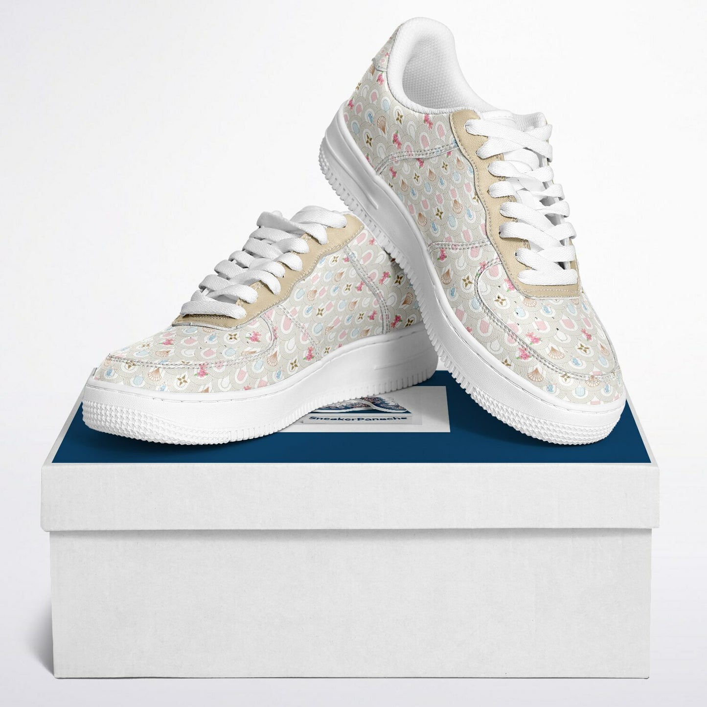 Low top sneakers with beige background and small pink flowers and blue birds.