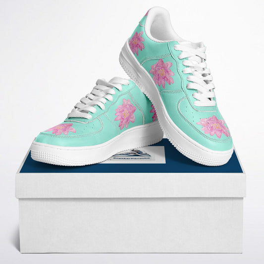 Low top sneakers in mint green with pink waterlillies.