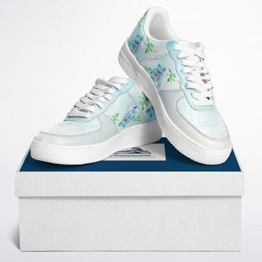 Low top sneakers n pale blue with blue flowers.